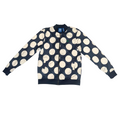 A navy blue bomber jacket with a large white polka dot pattern, laid flat on a light-colored surface. The jacket features a full front zipper, ribbed collar, cuffs, and hem, and an Adidas logo is visible on the inner neck label.